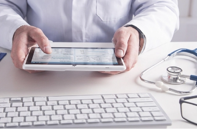Medical coder reviewing cardiology billing codes