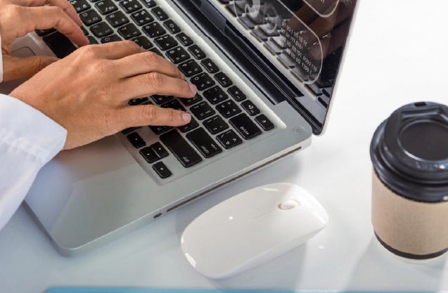 Consultant reviewing denial trend analytics