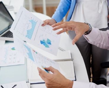 Experts analyzing financial reports