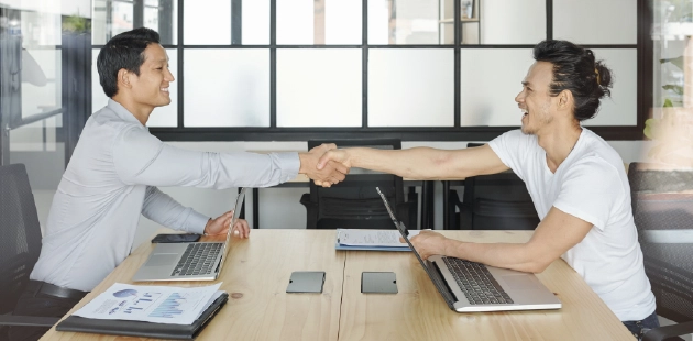 Business partners shaking hands