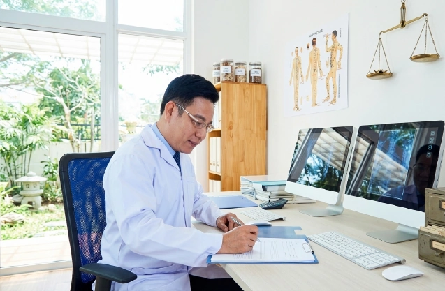 Doctor reviewing medical authorization